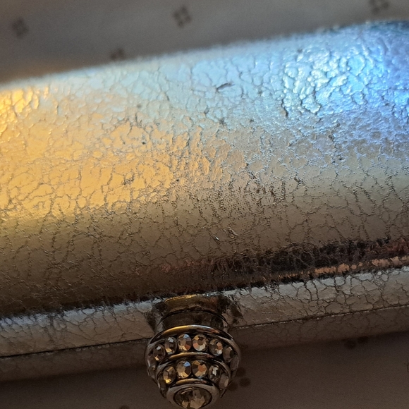 Bebe silver clutch. Revlon glosses are not included. Bag is brand new. - Picture 3 of 7
